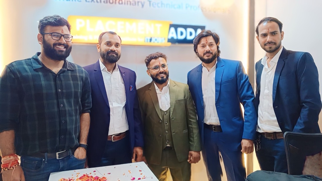 Placements Adda faculty team in front of the Placement Adda signboard